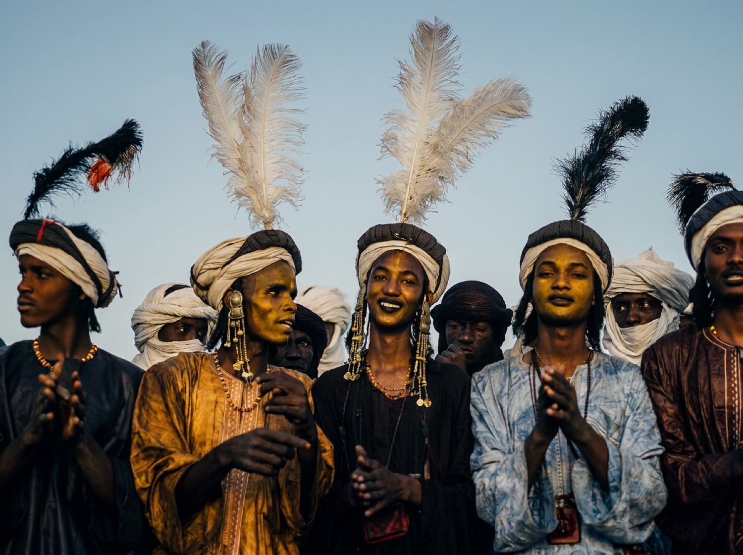 Wodaabe men in the yaake dance of the Gerewol festival, ornamented and judged by women